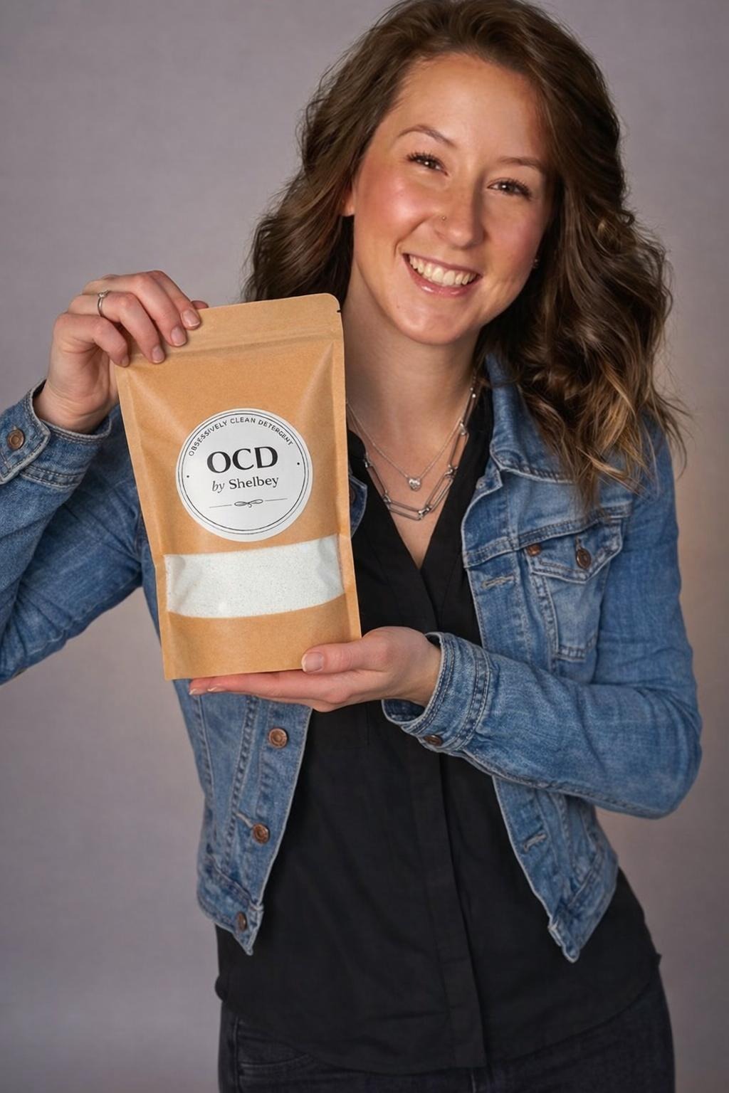 Shelbey holding OCD by Shelbey detergent